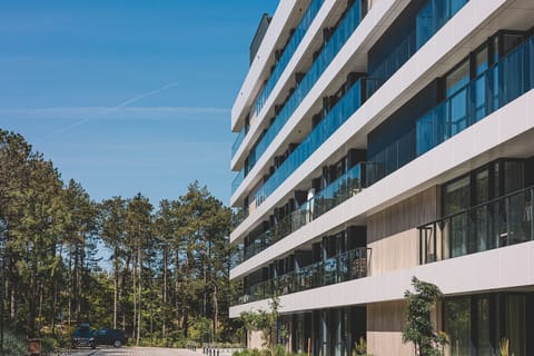 Building exterior. The beach is located behind the dune.