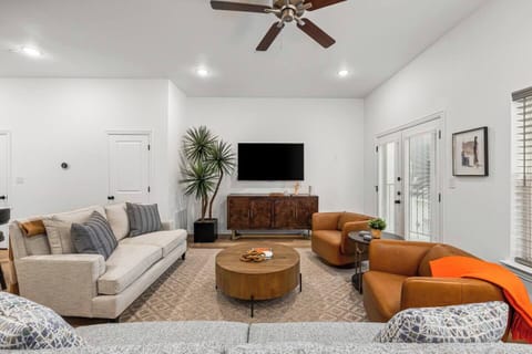 Relax in Style: Plush sofa and chairs, perfect for unwinding. The sofa doubles as a queen sleeper for extra comfort.
