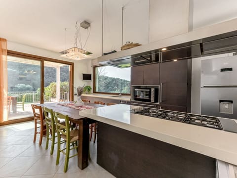 Kitchen, Countertop, Interior Design, Furniture, Flooring, Kitchen Appliance, Wood, Ceiling, Cabinetry, Light Fixture