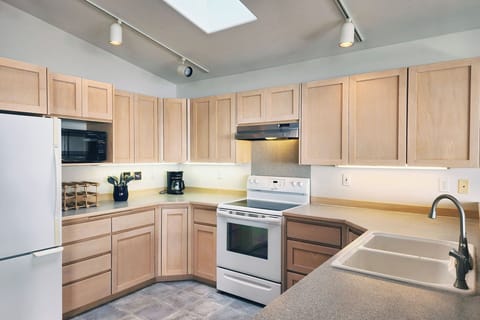 The cook in the kitchen can be part of the family hanging out.