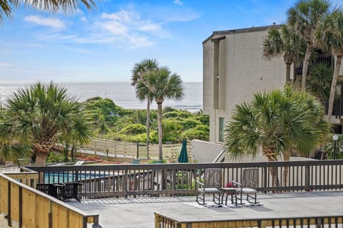 Private Butler Beach condo with balcony and partial ocean views – your relaxed St. Augustine beach home base with pool and easy beach access.