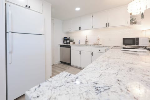 Updated kitchen with plenty of space for cooking, dining, and enjoying the beautiful beachside atmosphere