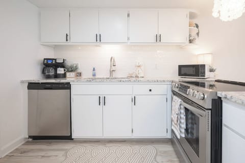 Bright and spacious kitchen with plenty of natural light—perfect for cooking, gathering, and enjoying the coastal vibes