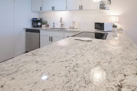 Spacious island for prepping meals or serving snacks—complete with beautiful coastal views to inspire every bite