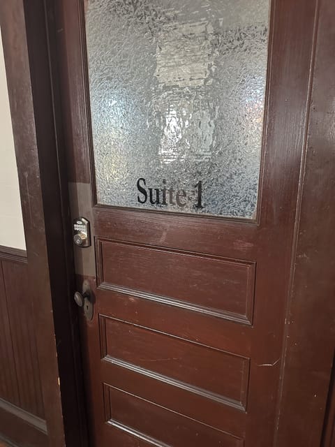 Entrance is to the left at the top of the stairs