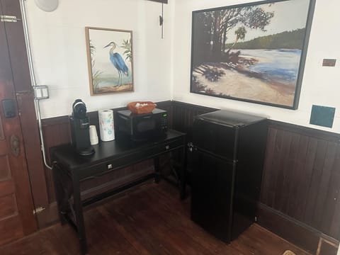 Keurig coffee maker (with pods), microwave and refrigerator in living area