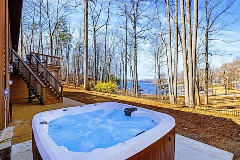 Hot Tub Escape – Warm, bubbling waters with a backdrop of trees and sky.