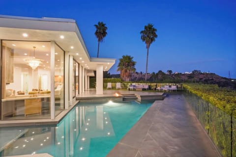 A sleek, private pool framed by palm trees and iconic views for ultimate relaxation.