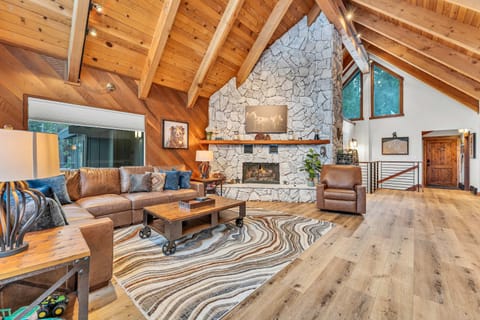 Living room 1: Smart TV, baseboard heating and no  A/C, gas fireplace. access to upper deck, main floor