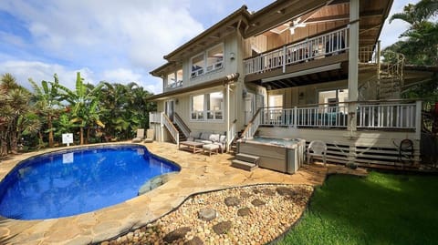 - Relax by the private pool surrounded by tropical palms   - Lounge on the stone patio with seating for everyone   - End the day in the soothing hot tub under the sky