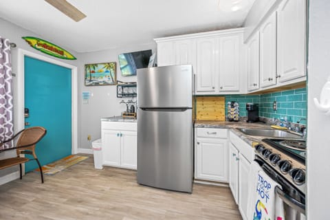 Vibrant kitchen featuring stainless steel appliances