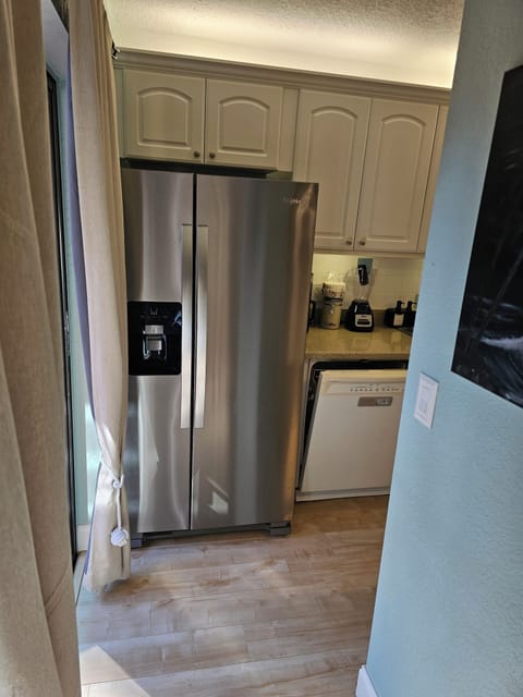 Walking into the kitchen.