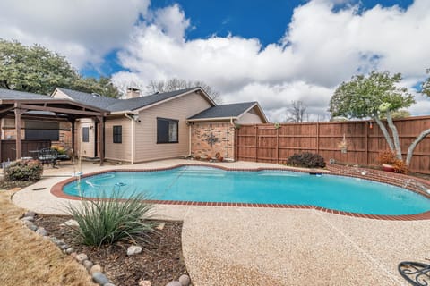 Family friendly swimming pool in private backyard