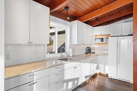 Full kitchen open to dining and living area