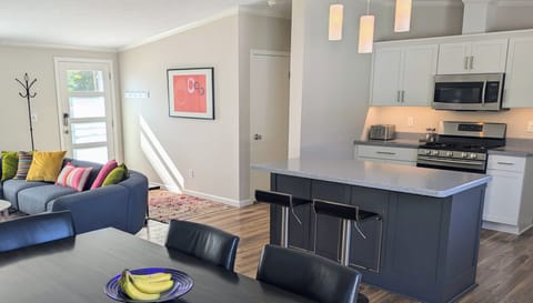 Kitchen island for a quick breakfast or cocktail hour. Undercounter power-strip