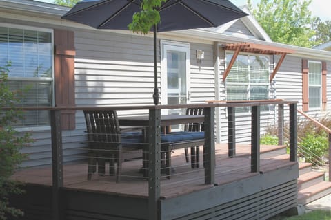 Enjoy meals outdoors on the shady deck overlooking the front lawn.