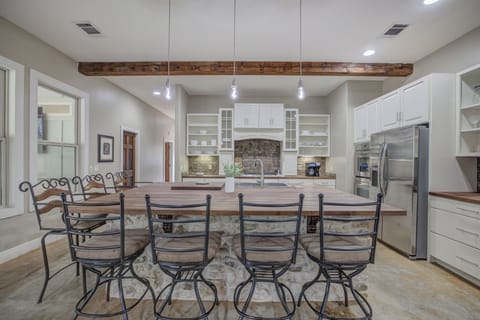 Large dining table with seating for everyone, set in a beautifully designed space with rustic accents.