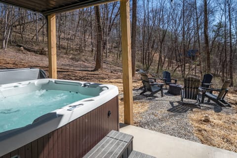 Relax in the private hot tub tucked beneath the deck allowing relaxation in all weatheror gather around the nearby fire pit for cozy evenings and conversation in the fresh air.