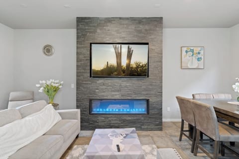 65" TV located in the living room with streaming content for family fun.