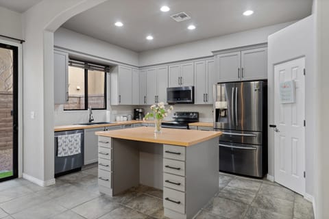 Kitchen is stocked with cooking essentials.