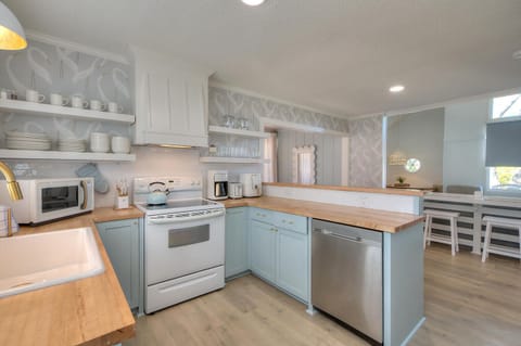 Charming, fully stocked kitchen.