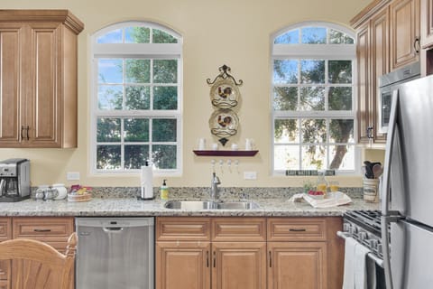 The kitchen stocked with all the essentials needed to cook a gourmet meal. (1)