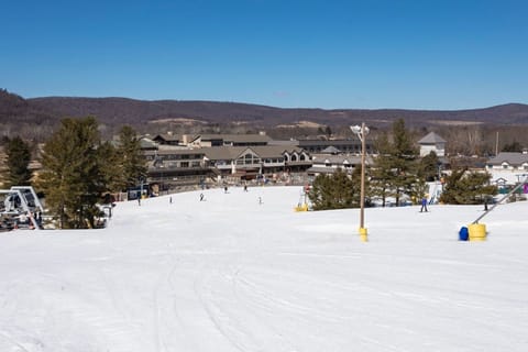Snow-covered trails with breathtaking valley views invite you to carve your perfect run.