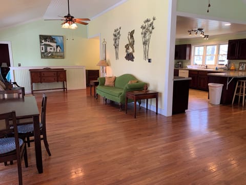 Living room opens to dining room and kitchen on the main level.