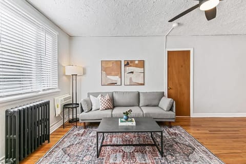 Lots of south facing window light for lounging on the three person couch 