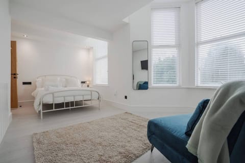 Studio apartment, showing double bed, entrance to the bathroom and sofa bed