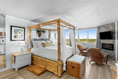 Queen bed with luxury mattress, partial beach view