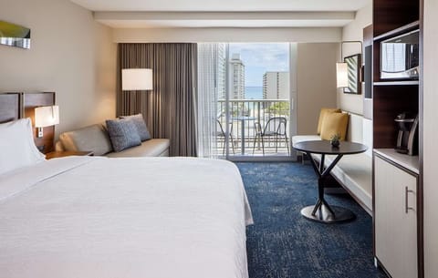 Step into a sunlit retreat with balcony views and seating.