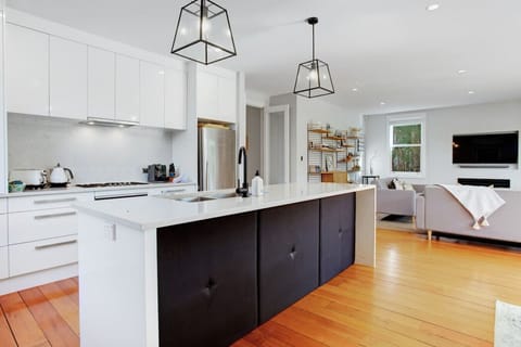 The kitchen has a gas cooktop, oven, dishwasher, microwave and fridge/freezer.