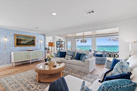 This Beachfront Home is Totally Remodeled and Professionally Decorated with colorful and beachy décor, comes fully-stocked, and is situated on a Private Beach!