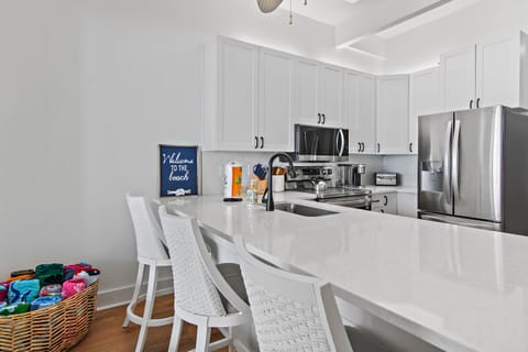 1st Floor Living Space has a full kitchen, living room, patio access, and Gulf Views!