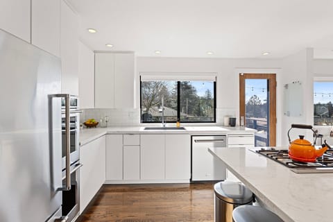 Gourmet kitchen with 5 burner gas Bertazoni stove top, Kitchen Aid appliances, double oven, Berkey water filter system, & Breville Espresso maker