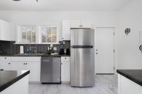 There is a dishwasher and refrigerator.