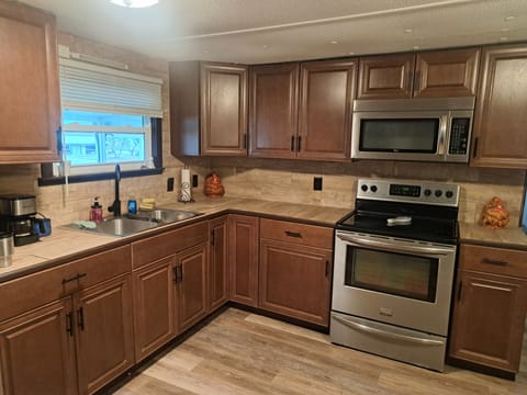 Full Kitchen, stove, oven, microwave, fridge.