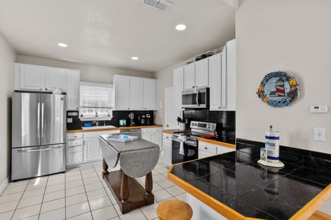 Fully equipped kitchen with modern appliances and plenty of prep space.
