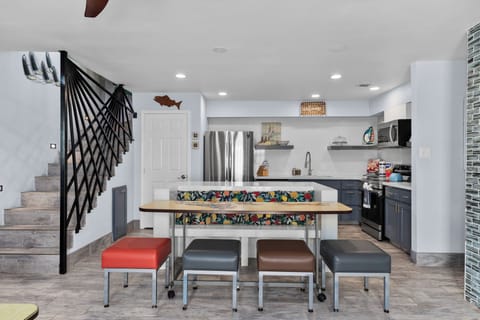 Modern kitchen with island seating and stainless steel appliances