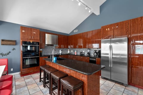 Fully equipped kitchen with bold design and plenty of space to gather