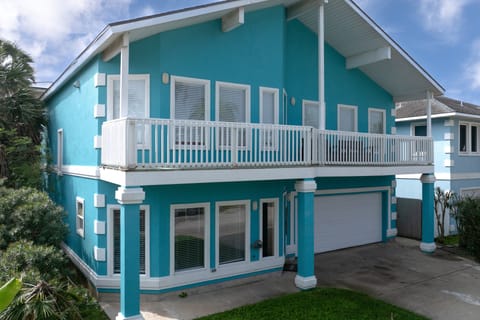 Coastal home exterior with upper deck and beachy charm
