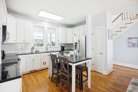 Gourmet kitchen featuring stainless steel appliances and an island.