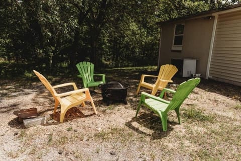 Outdoor fire pit with colorful seating for relaxing evenings.