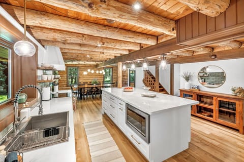 Bright and welcoming, the kitchen is designed for both function and fun, with plenty of space to gather around the counter.
