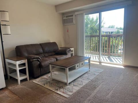 Spacious living room with balcony.