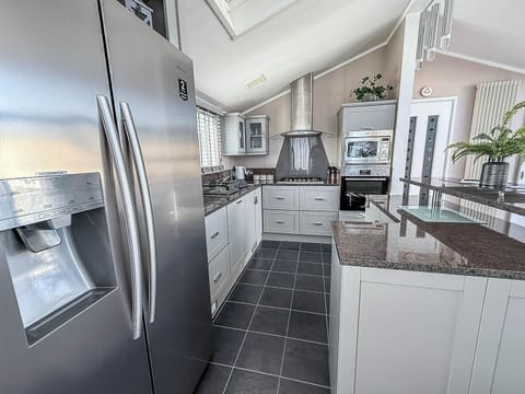 Modern kitchen with sleek appliances and spacious countertops