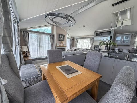 Cozy dining nook with modern kitchen and natural light