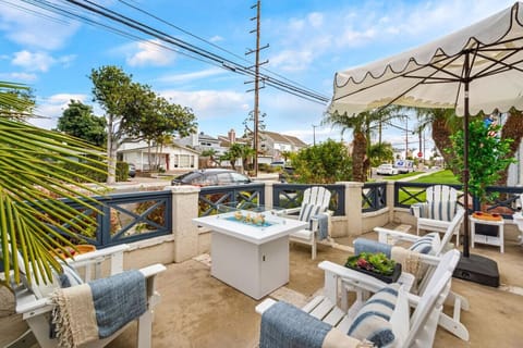 Relax in this stylish outdoor lounge with large umbrella.