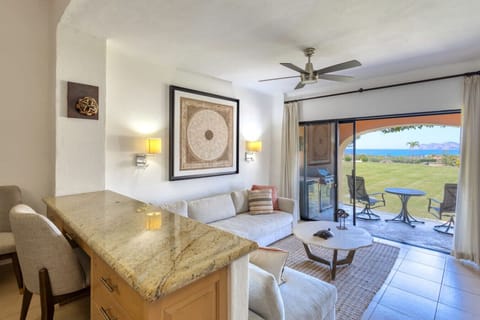 Comfortable living space with sofa and direct patio access.